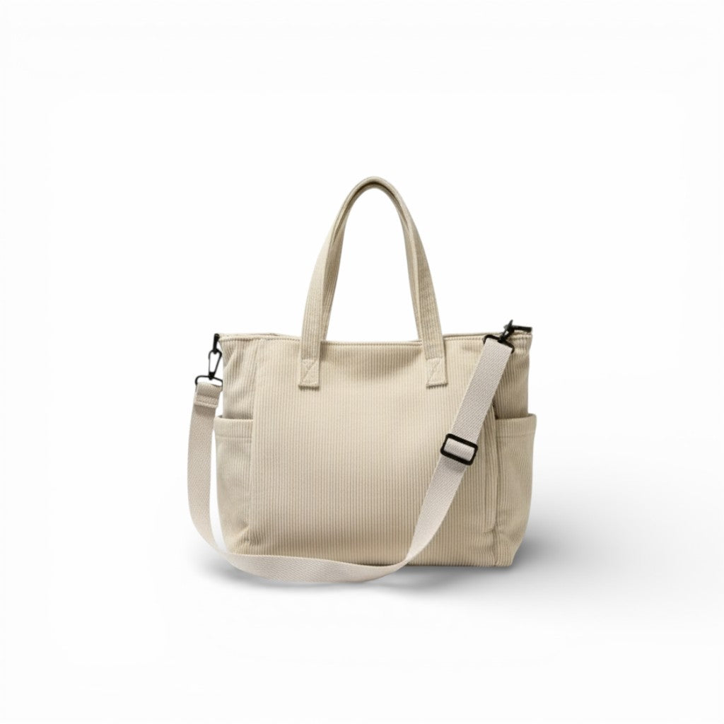 Beige tote bag with a shoulder strap on a white background