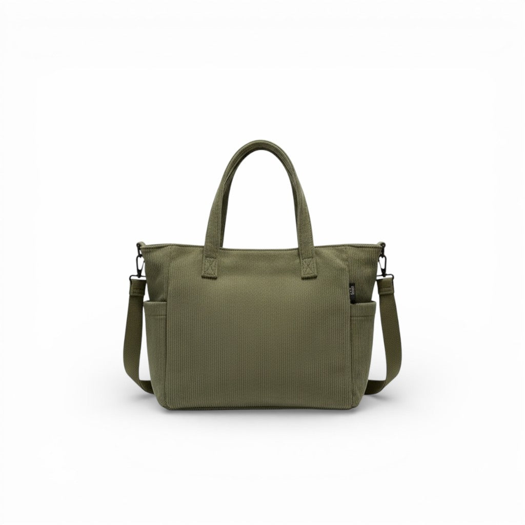 Green handbag with a shoulder strap on a white background