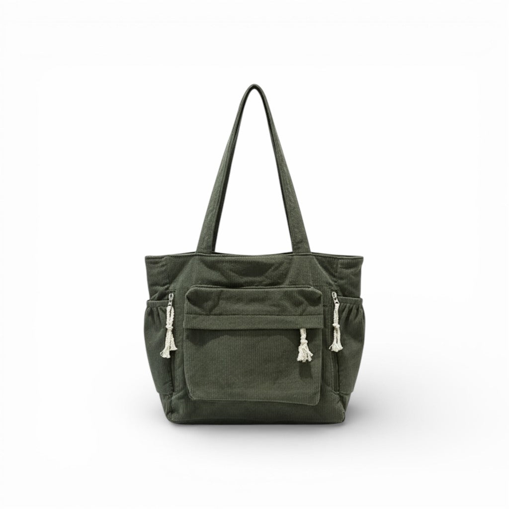Green tote bag with multiple pockets and handles on a white background