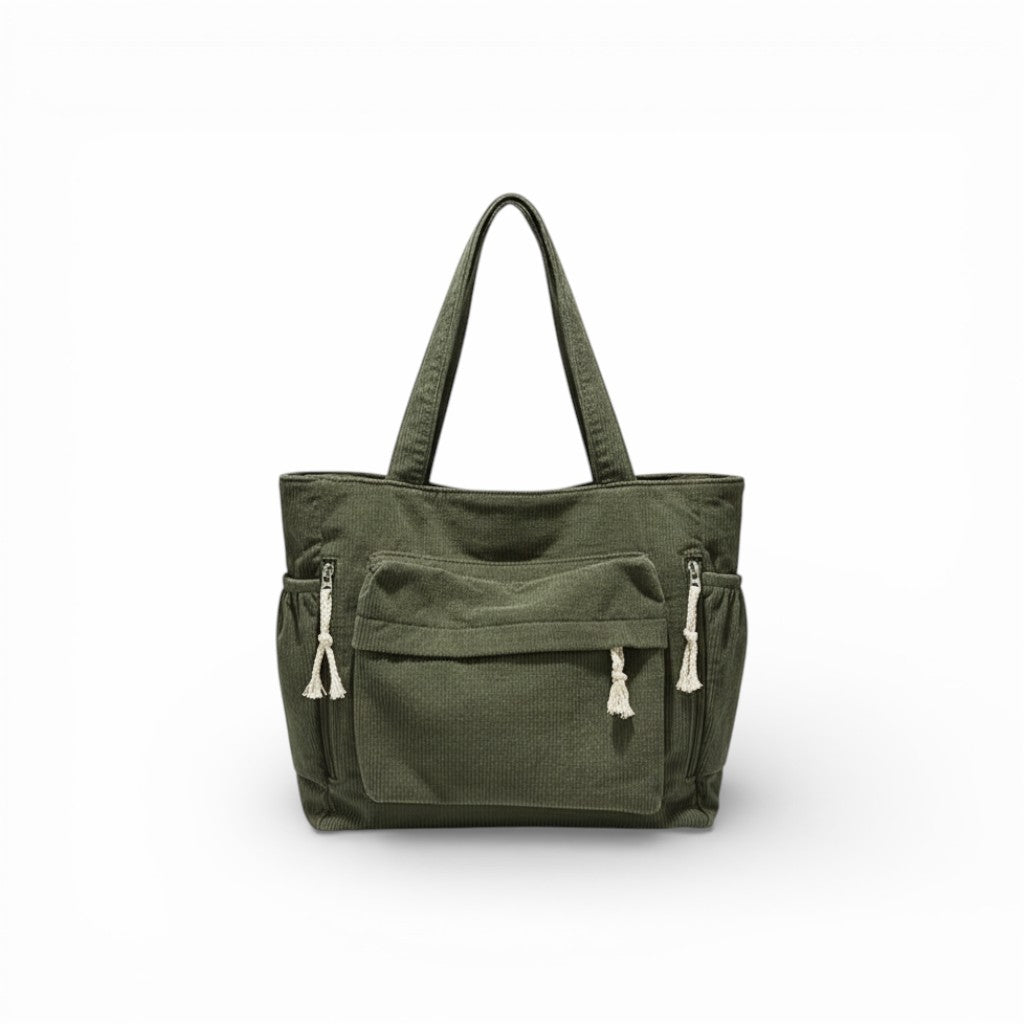 Green tote bag with multiple pockets on a white background