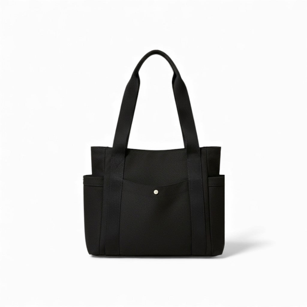 Black tote bag with multiple pockets on a white background