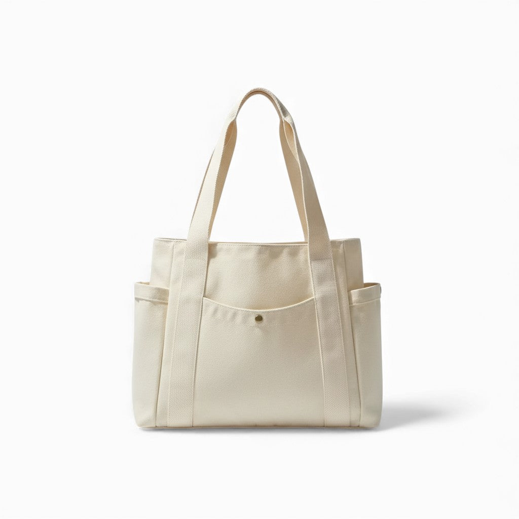 Beige tote bag with multiple pockets on a white background