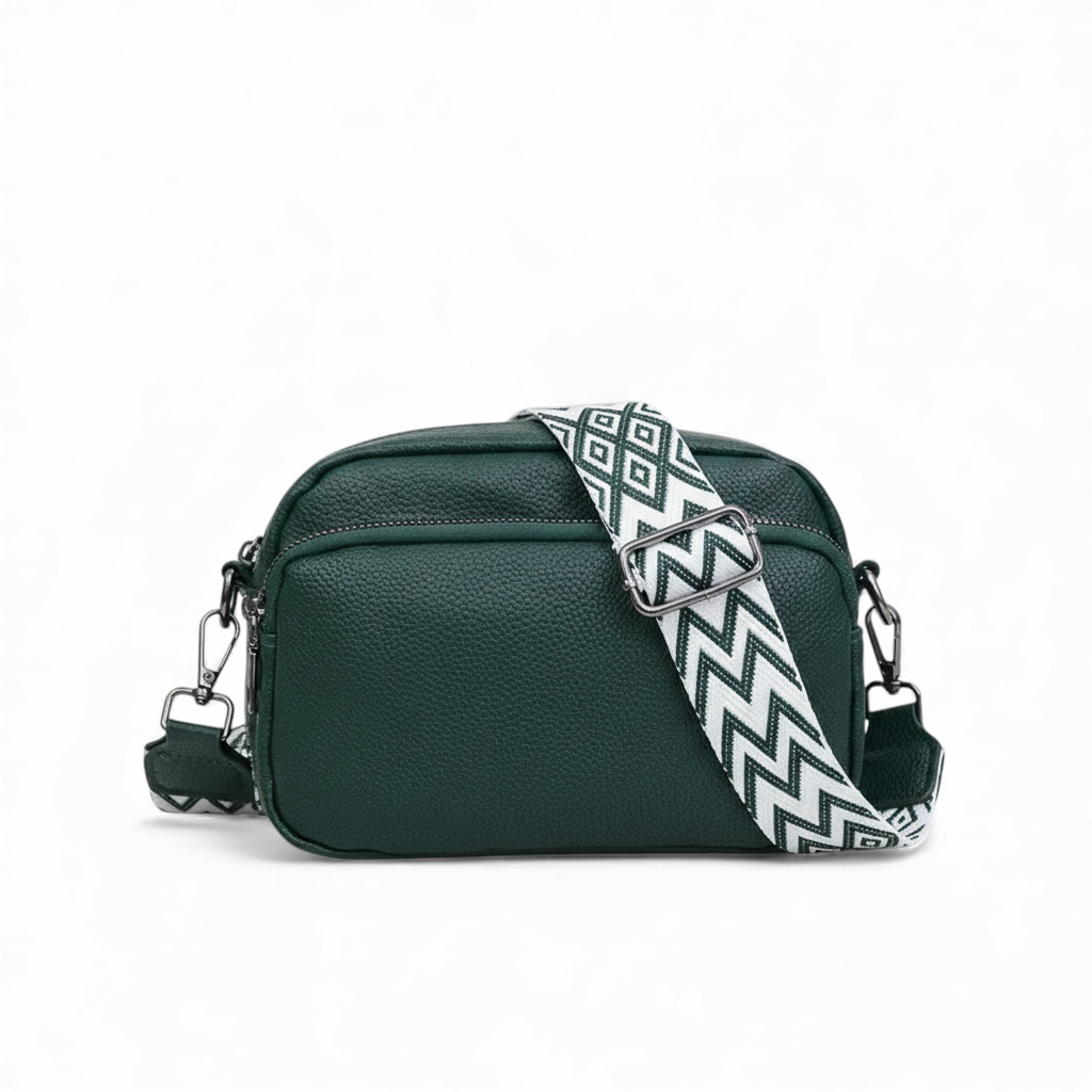 Green handbag with a patterned strap on a white background