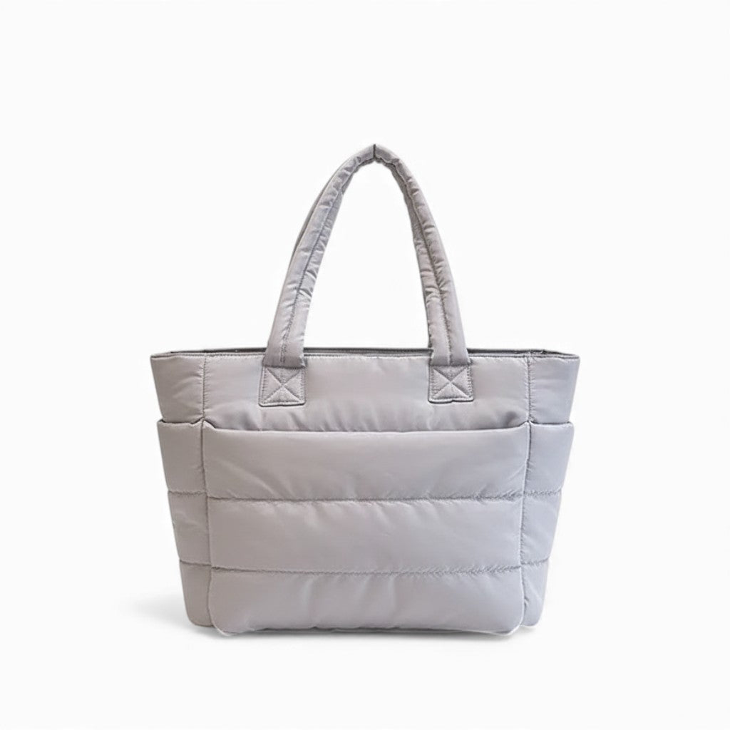 Gray quilted tote bag on a white background