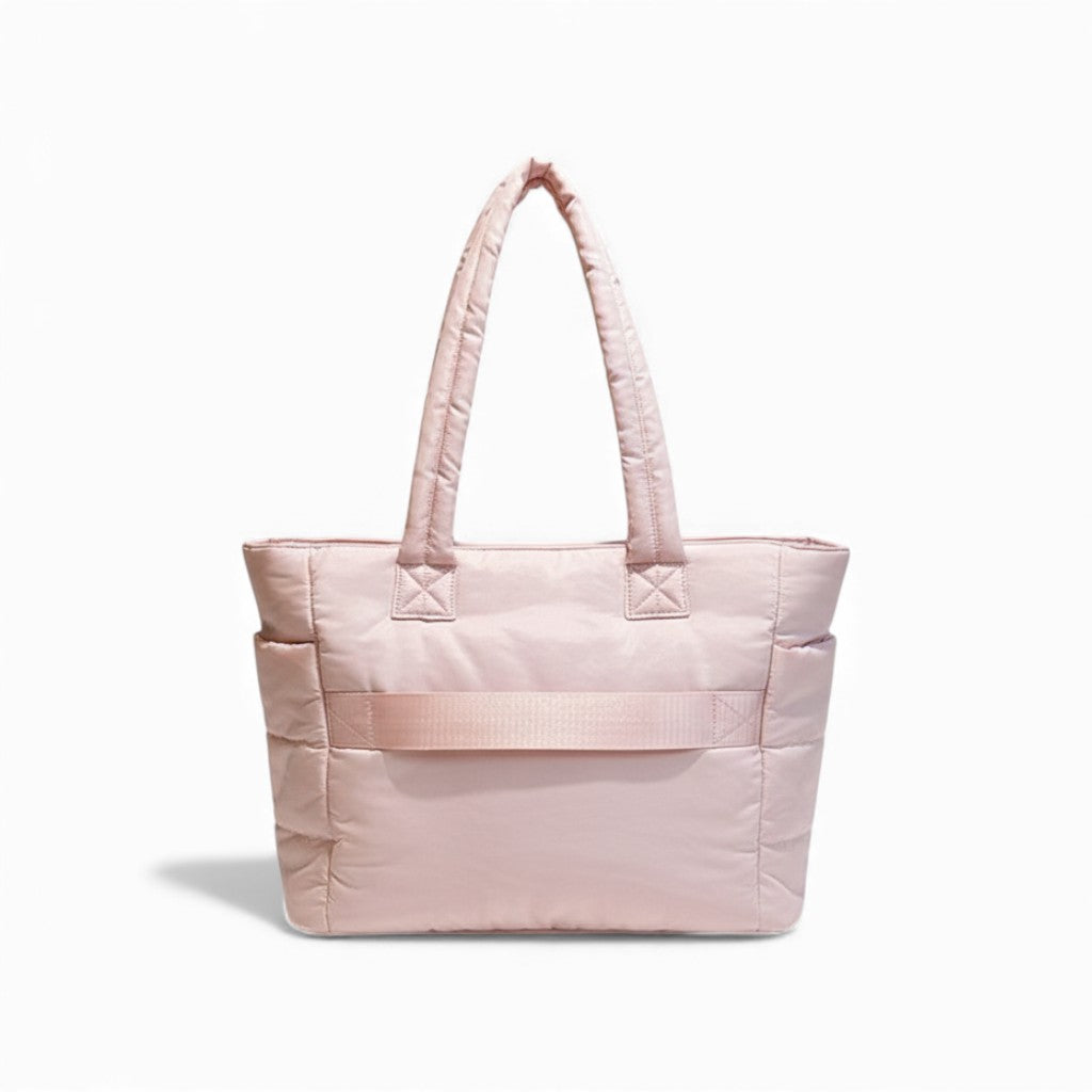 Pink quilted tote bag on a white background