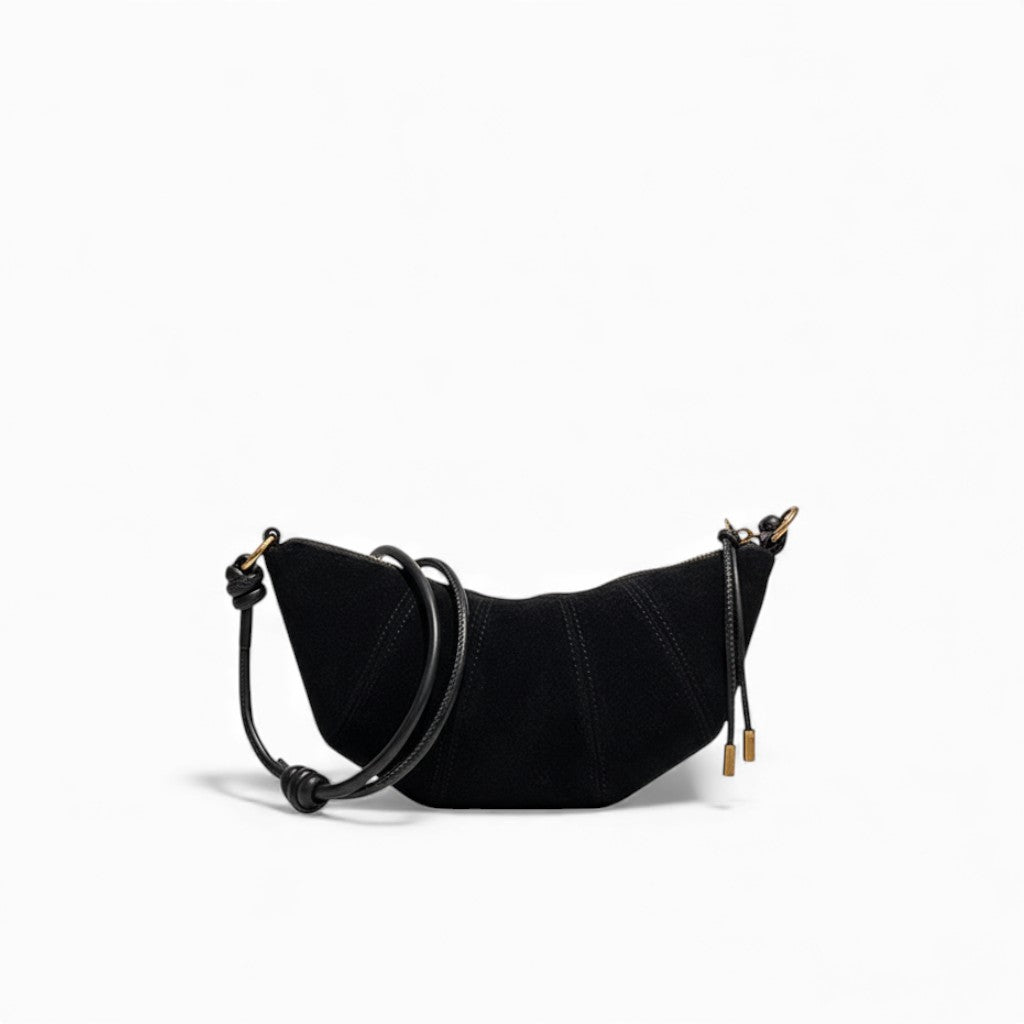 Black handbag with gold accents on a white background