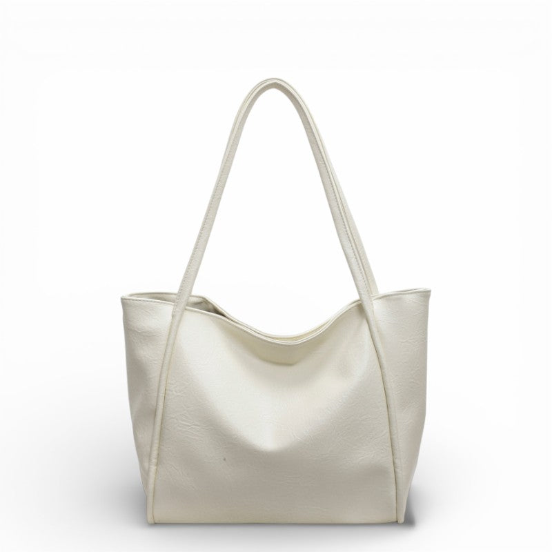 Beige handbag on a white background