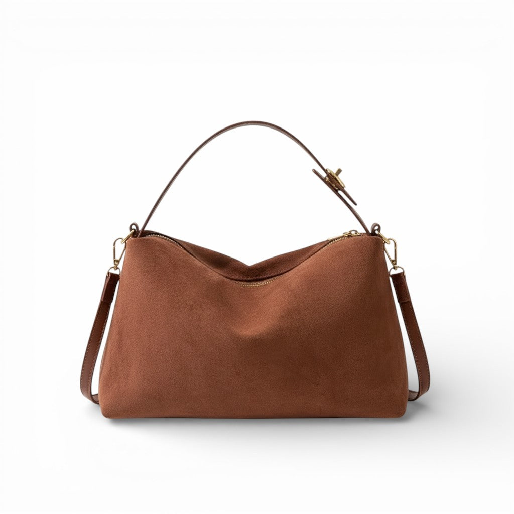Brown leather handbag on a white background